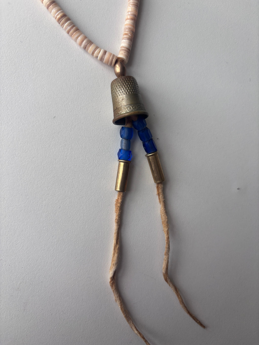 sɬk̓ʷaɬq̓ʷlt  plateau-style necklace
